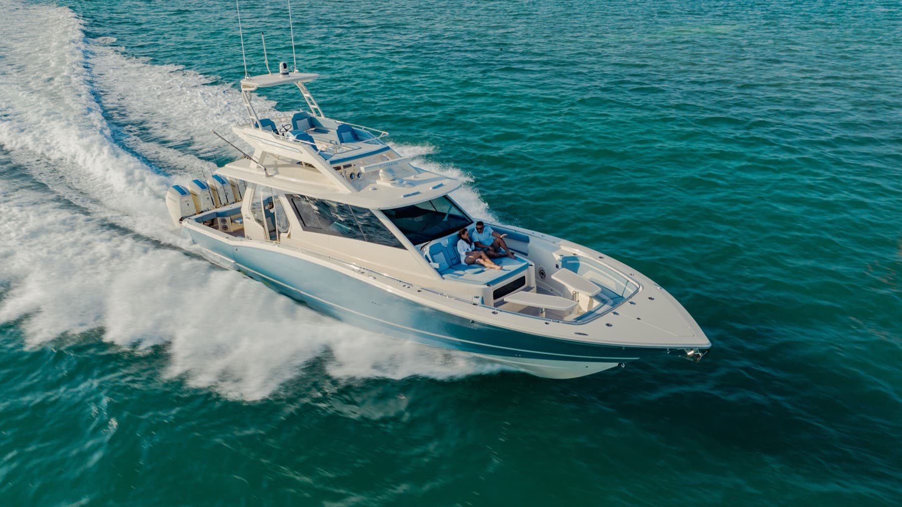 Aerial of Scout 530 LXF running at speed across emerald water